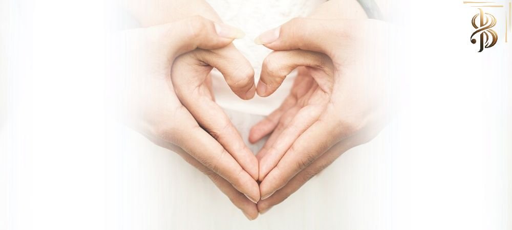 2 hands forming a heart covered by two other hands imitating the shape of the heart as a symbol of respect and consent.